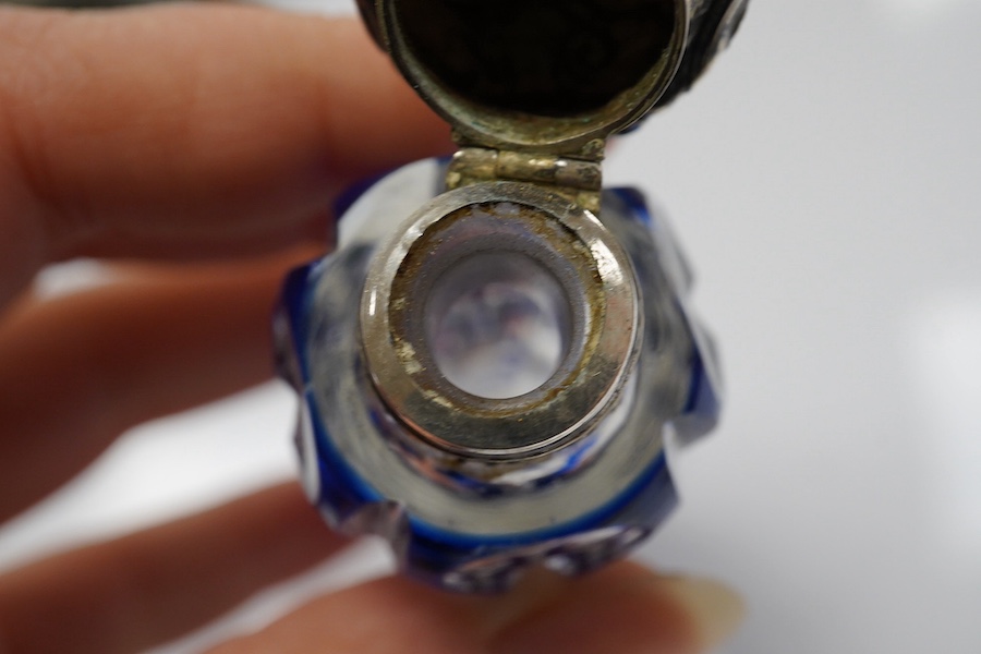 A 19th century silver topped blue overlay glass scent bottle, 11cm long. Condition - fine chips to base